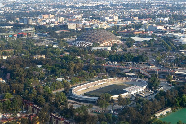 Oblique angle aerial view through plane window over Mexico City