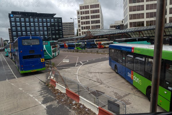 View through bus window of buses in bus station in the town centre