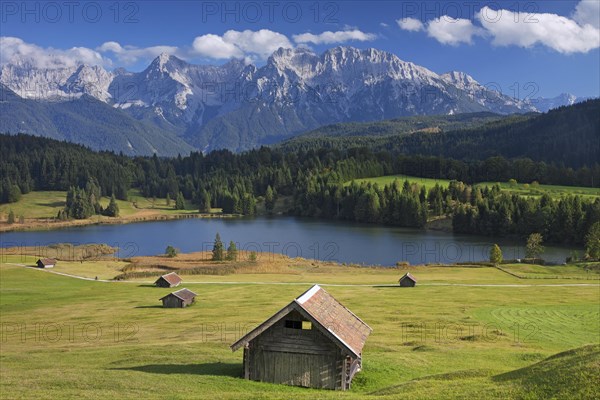 The Karwendel Mountain Range and huts along lake Gerold