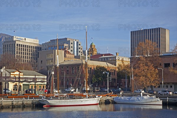Sailing ship and yacht docked in the Hobart harbour