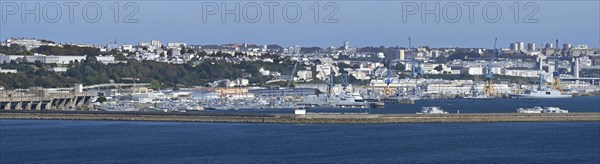 Panoramic view over German WW2 U-boat submarine pen and French Navy ships docked in the port