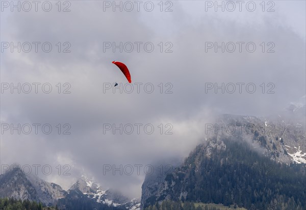 Paragliding under a cloudy sky