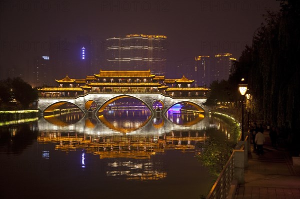 Illuminated Anshun Bridge over the Jin River at night in the provincial capital of Chengdu in Sichuan