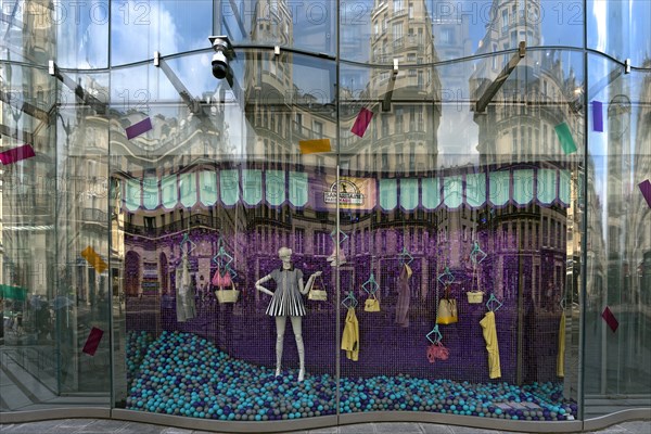 Shop window with reflection of the exclusive department stores' La Samaritaine