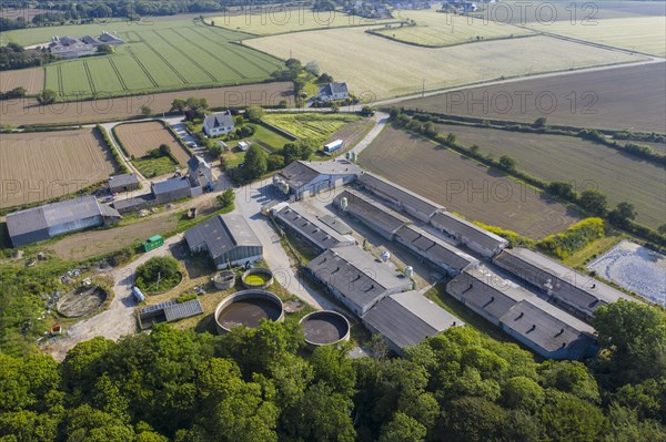 Aerial view of pig farm with closed stables and manure reservoirs