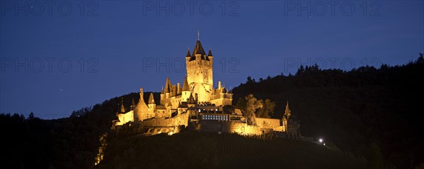 Illuminated Reichsburg Cochem in the evening