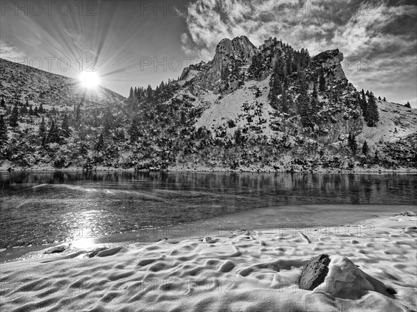 Frozen lake with mountain and snow