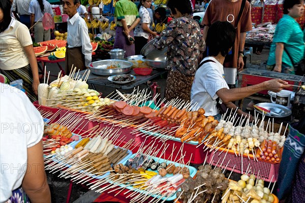 Sausages and food on skewers