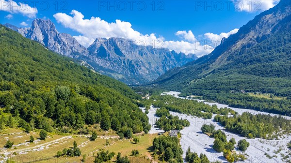 Aerial drone view of Valbona valley and dry river in summer