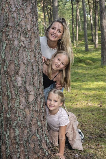 Blonde woman with two girls