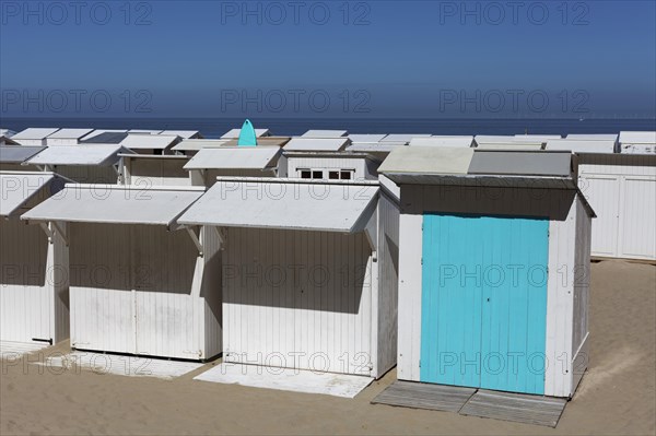 Uniform white beach huts