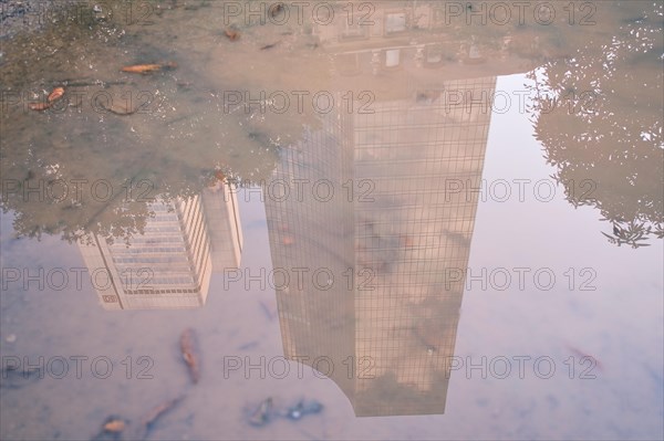 Reflection in a puddle from a building in the banking district
