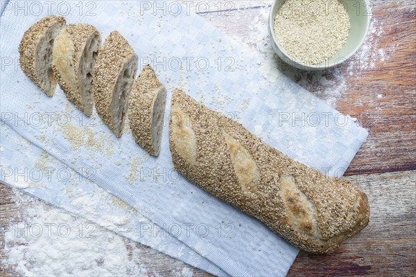 Freshly baked vegan baguette with sesame seeds