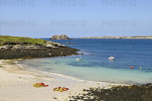 Small bay with canoes on the island of Ouessant