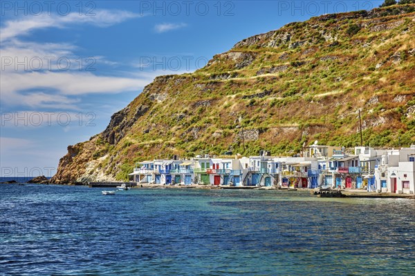 Colorful village of Klima with Greek whitewashed houses on sunny day