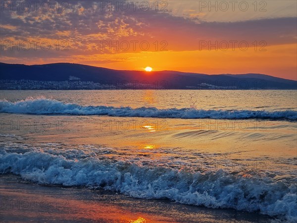 Beautiful sunrise at the Bulgarian coastline of Black Sea. Sunny beach resort