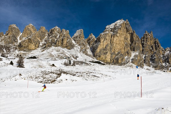 Snow-covered mountains and skiers