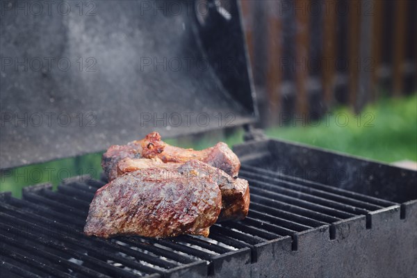 Closeup view of New York strip steak on grill