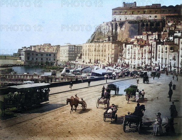 View of the quay in the Santa Lucia district of Naples with carts and horse-drawn carriages