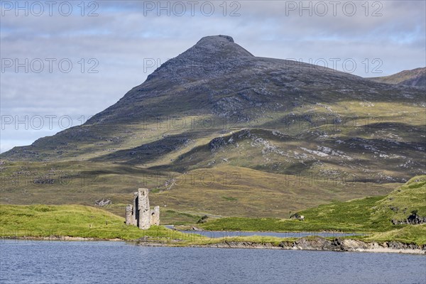 The ruins of Ardvreck Castle on a peninsula by the loch of Loch Assynt