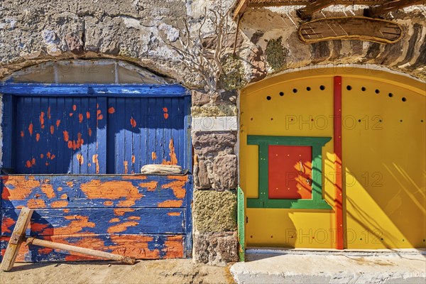 Colorful blue and yellow boat garage doors