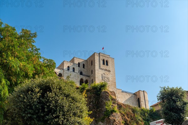 View from below of Kruje Castle and its fortress with the walls. Albania