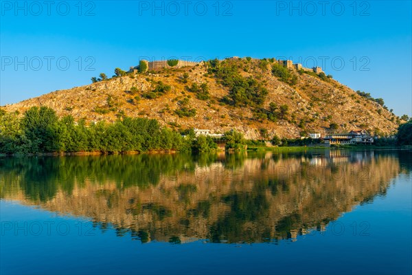 View of Rozafa Castle from a boat on a sightseeing excursion on Lake Shkoder in Shiroka. Albania