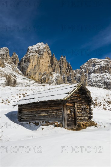 Snow-covered mountains and alpine hut