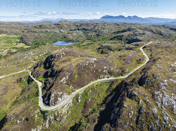 Aerial view of the sparsely populated Northwest Highlands with the single track road and pass road B869