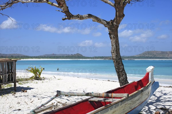 Small boat lying in the sand on the beach