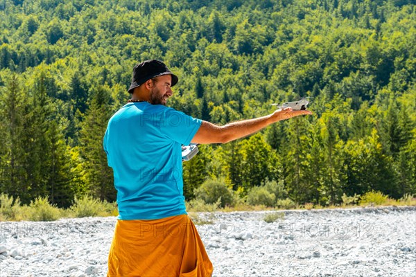 Drone pilot man taking off the drone on the mountain in Valbona natural park. Albania