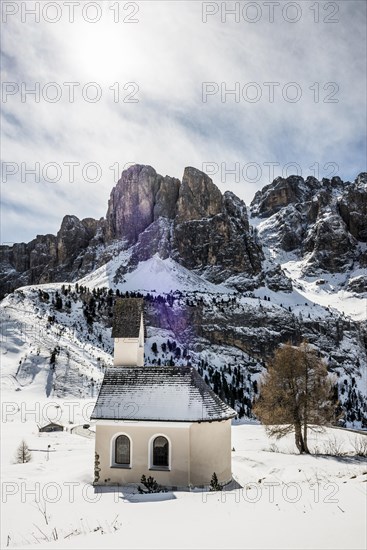 Snow-covered mountains and chapel