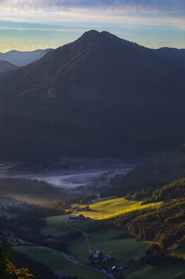 Farms at sunrise and morning fog near Ebenau