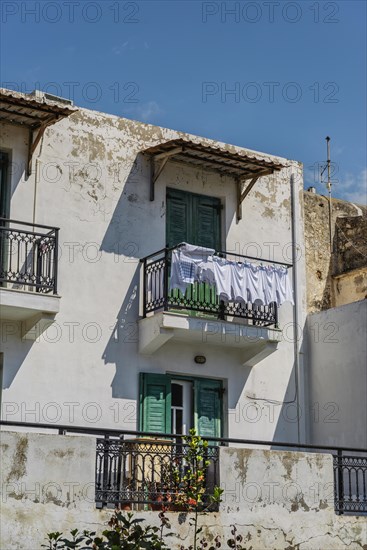 House with white linen on the line