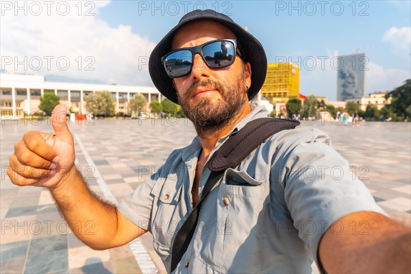 Selfie of a tourist man at Skanderbeg square in Tirana. Albania