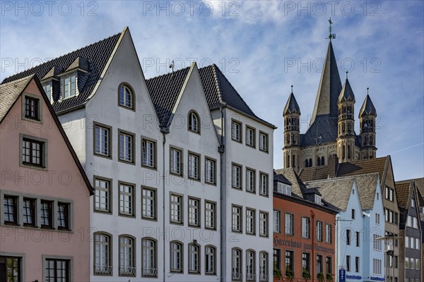 Gabled houses in the old town of Cologne at the Fischmarkt and the church Gross St. Martin