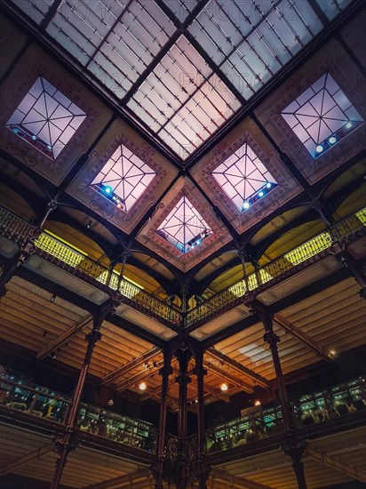 Architectural details of the glowing glass ceiling inside the Museum of Natural History