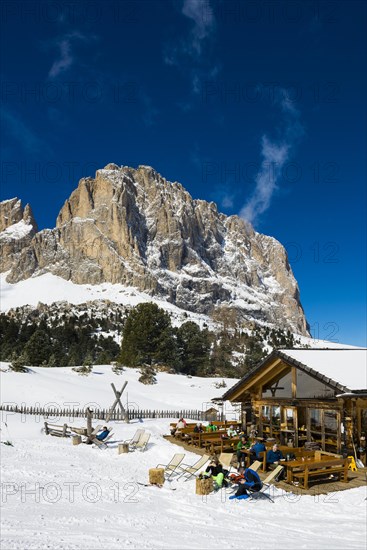 Snow-covered mountains and ski hut