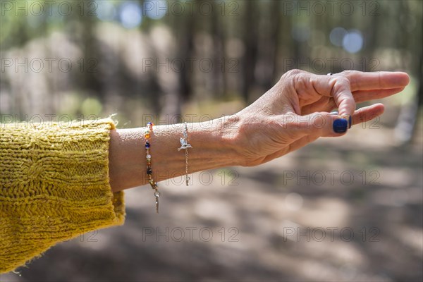 Chin mudra close up over nature background