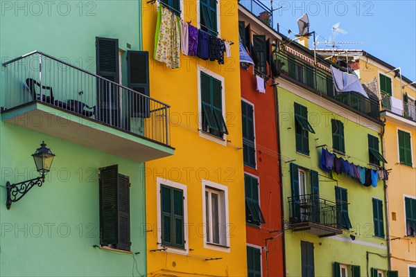 Colourful house facades with clotheslines