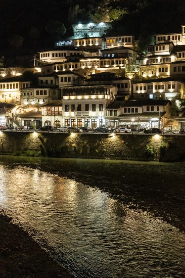 The illuminated historic city of Berat in Albania from the river