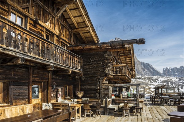 Snow-covered mountains and ski hut