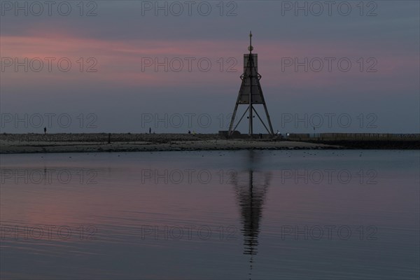 Kugelbake with water reflection in the sunset