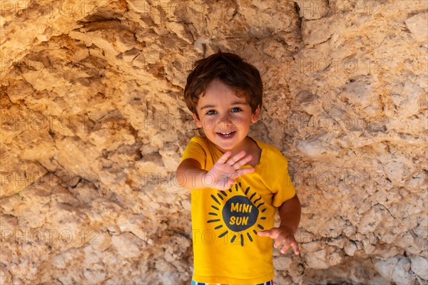 Boy having fun on Porto Katsiki beach in Lefkada island on vacation