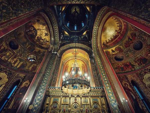 Interior architectural details of the Curtea de Arges monastery. The tall hall with painted icons