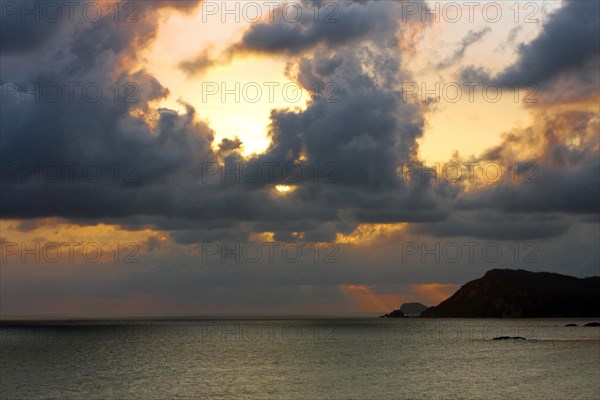 Tropical cloudy sky at sunset