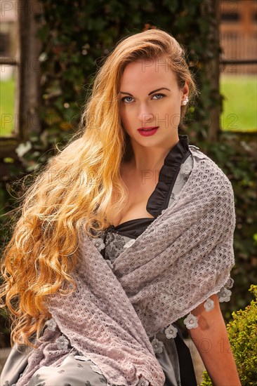 Woman with long hair and dirndl