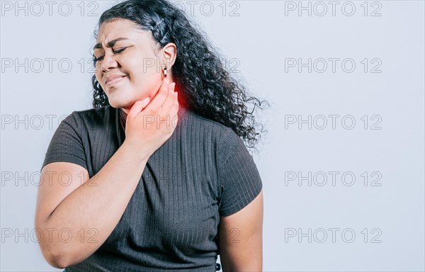 Young woman suffering with neck pain. Neck pain and stress concept. People with neck tension