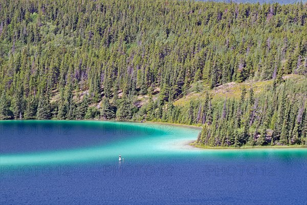 Transparent clear lake with green water colour