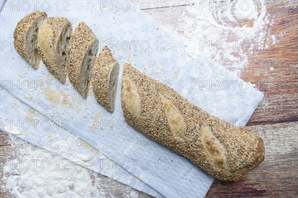 Freshly baked vegan baguette with sesame seeds